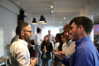 a group of people standing in a room